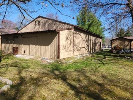 4297 N Wilderness Trl, Luther, MI 49656 - view of side of property featuring a lawn