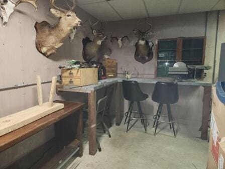 4297 N Wilderness Trl, Luther, MI 49656 - kitchen featuring a drop ceiling and concrete floors