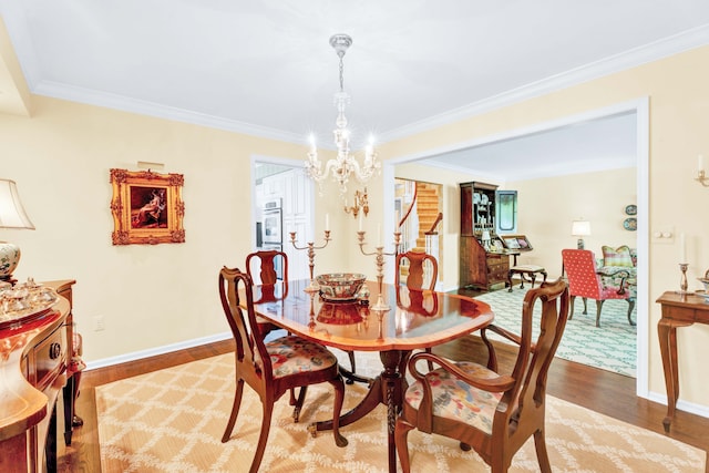 22366 Valley Oaks Dr, Beverly Hills, MI 48025 - dining space with a chandelier, light wood-style floors, crown molding, and baseboards