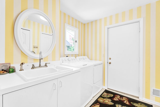 22366 Valley Oaks Dr, Beverly Hills, MI 48025 - laundry area featuring wallpapered walls, independent washer and dryer, and cabinet space