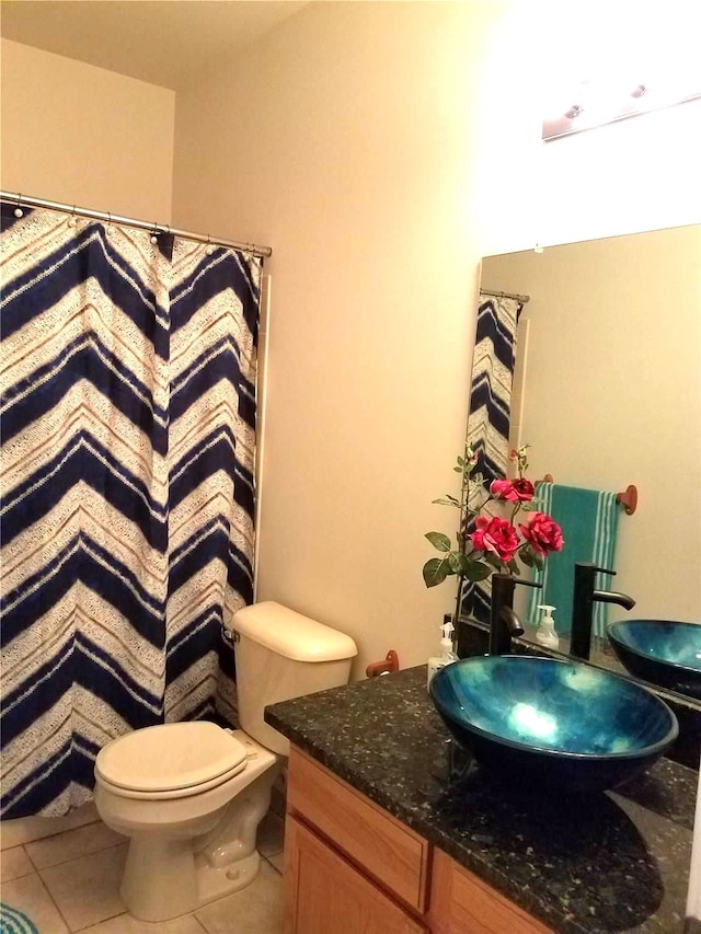 full bath with tile patterned floors, vanity, toilet, and a shower with curtain