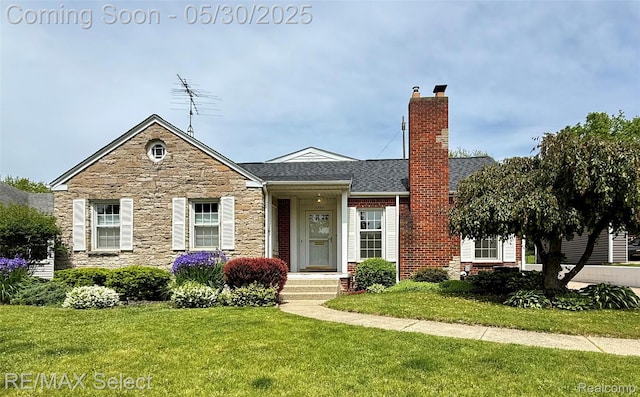 2302 Radcliffe Ave, Flint, MI 48503 - view of front of property featuring stone siding, a front yard, a chimney, and roof with shingles