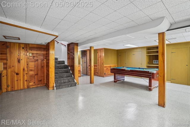 2302 Radcliffe Ave, Flint, MI 48503 - finished below grade area featuring a paneled ceiling, stairs, pool table, and wooden walls