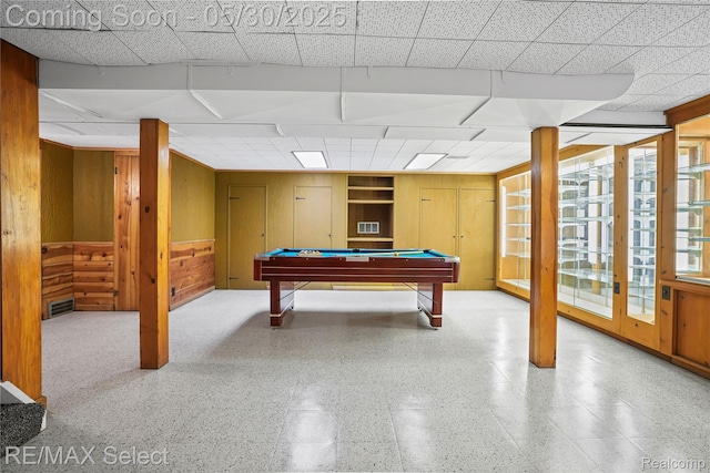 2302 Radcliffe Ave, Flint, MI 48503 - playroom with wood walls, billiards table, and a paneled ceiling