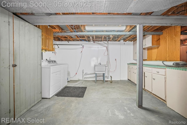 2302 Radcliffe Ave, Flint, MI 48503 - unfinished basement featuring independent washer and dryer, a sink, and wood walls