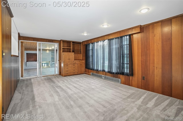 2302 Radcliffe Ave, Flint, MI 48503 - empty room featuring wooden walls and carpet