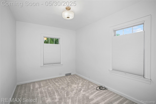 2302 Radcliffe Ave, Flint, MI 48503 - carpeted empty room with healthy amount of natural light and baseboards