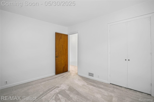 2302 Radcliffe Ave, Flint, MI 48503 - unfurnished bedroom with carpet floors, a closet, and baseboards