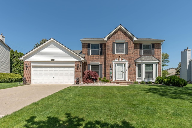 5835 S Ashford Way, Ypsilanti, MI 48197 - view of front of property featuring brick siding, a front lawn, a garage, and concrete driveway