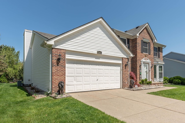 5835 S Ashford Way, Ypsilanti, MI 48197 - traditional-style house featuring an attached garage, concrete driveway, brick siding, a front lawn, and central air condition unit