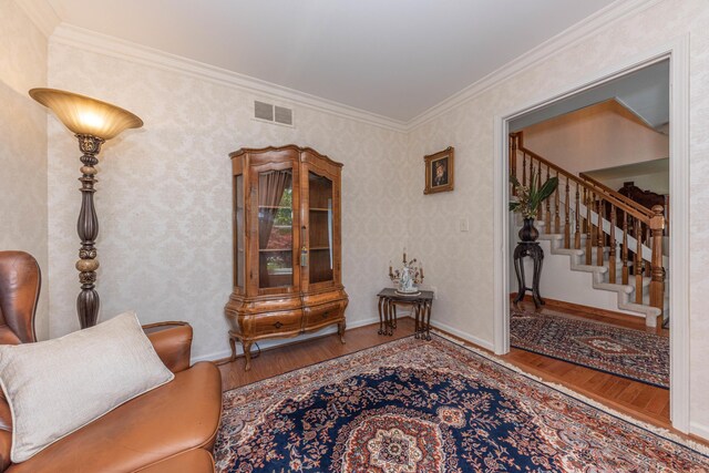 5835 S Ashford Way, Ypsilanti, MI 48197 - sitting room with wood finished floors, ornamental molding, and stairs
