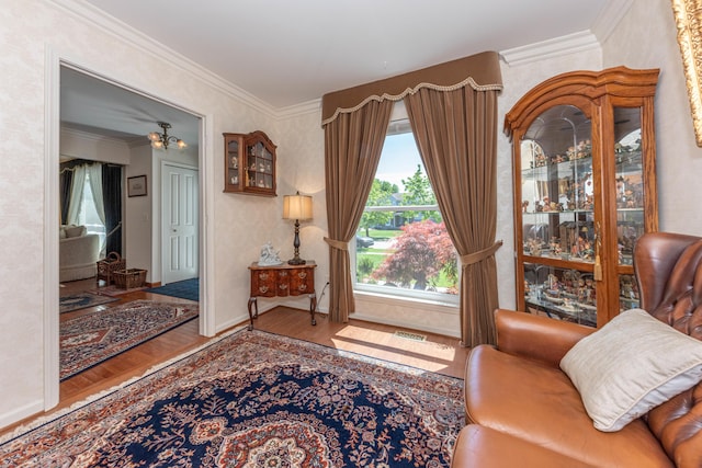 5835 S Ashford Way, Ypsilanti, MI 48197 - sitting room featuring wood finished floors, crown molding, and baseboards