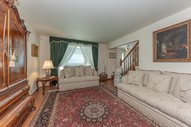 5835 S Ashford Way, Ypsilanti, MI 48197 - living room featuring wood finished floors, stairway, and baseboards