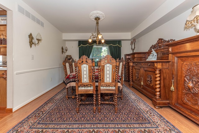 5835 S Ashford Way, Ypsilanti, MI 48197 - dining room featuring a chandelier and light wood-type flooring