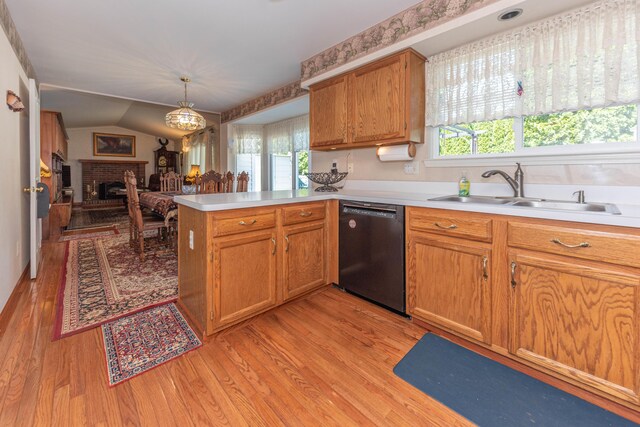 5835 S Ashford Way, Ypsilanti, MI 48197 - kitchen featuring dishwashing machine, a sink, light wood finished floors, a peninsula, and light countertops
