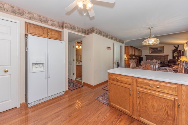 5835 S Ashford Way, Ypsilanti, MI 48197 - kitchen featuring white refrigerator with ice dispenser, open floor plan, ceiling fan, light wood-type flooring, and light countertops
