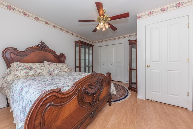 5835 S Ashford Way, Ypsilanti, MI 48197 - bedroom featuring light wood-style floors, a closet, and a ceiling fan