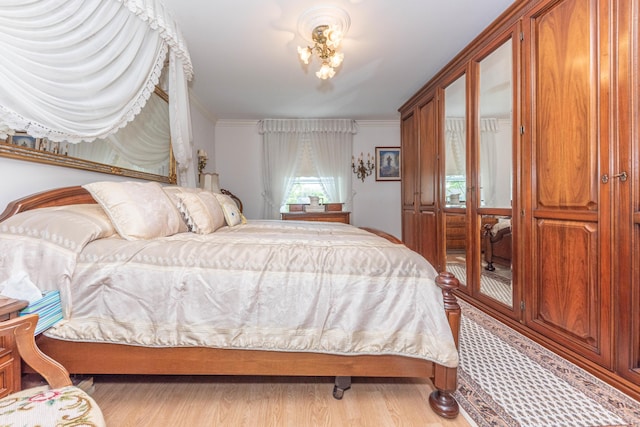 5835 S Ashford Way, Ypsilanti, MI 48197 - bedroom with wood finished floors and crown molding