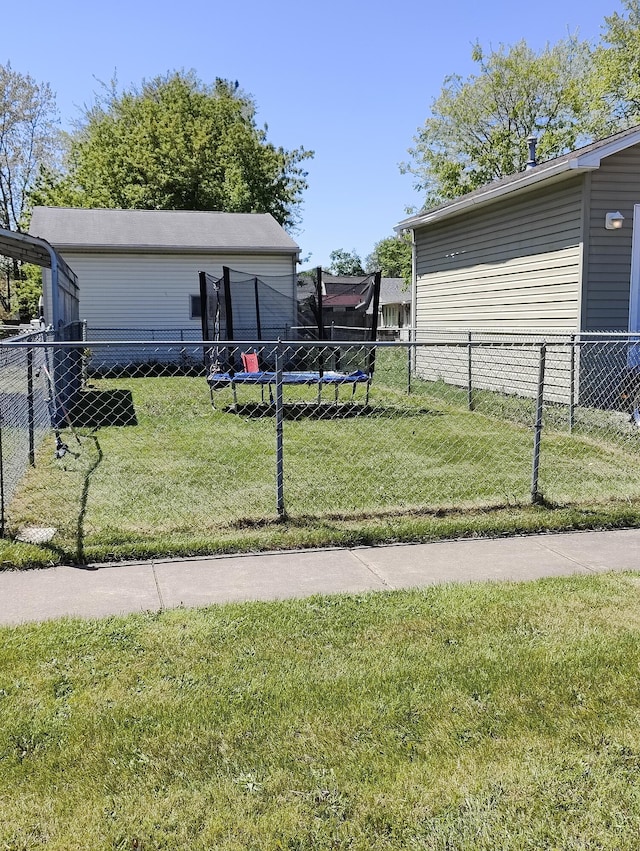 view of yard with a trampoline
