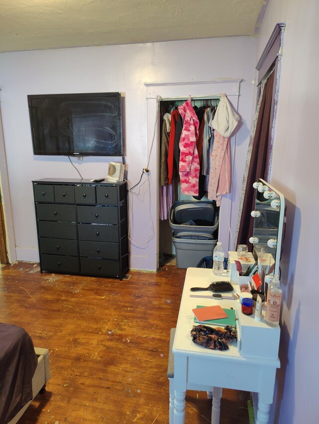 bedroom featuring wood finished floors