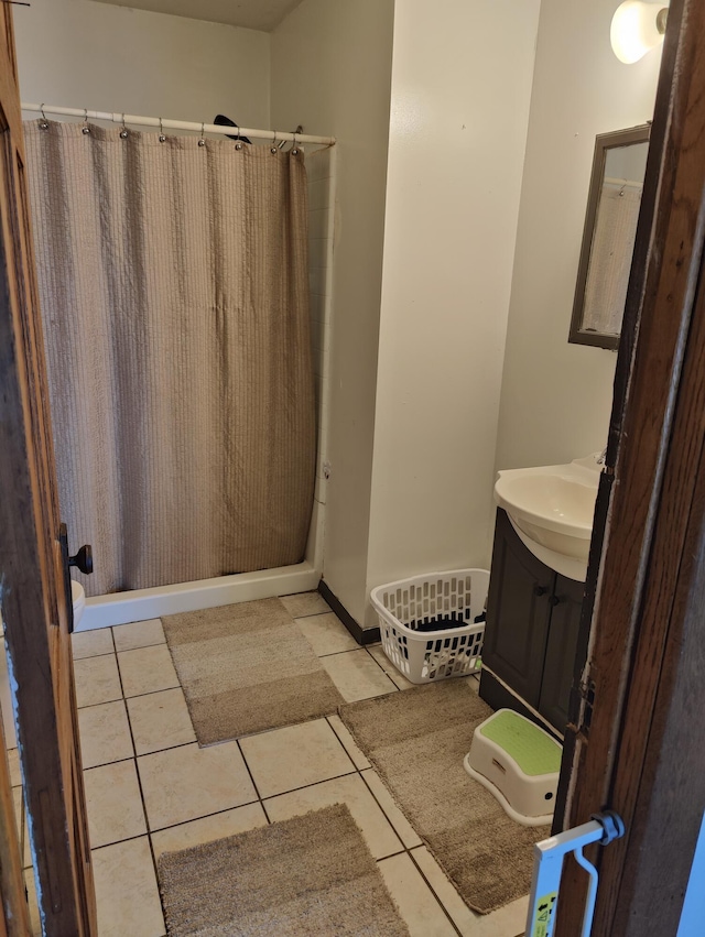 full bath featuring vanity, a shower with curtain, and tile patterned flooring