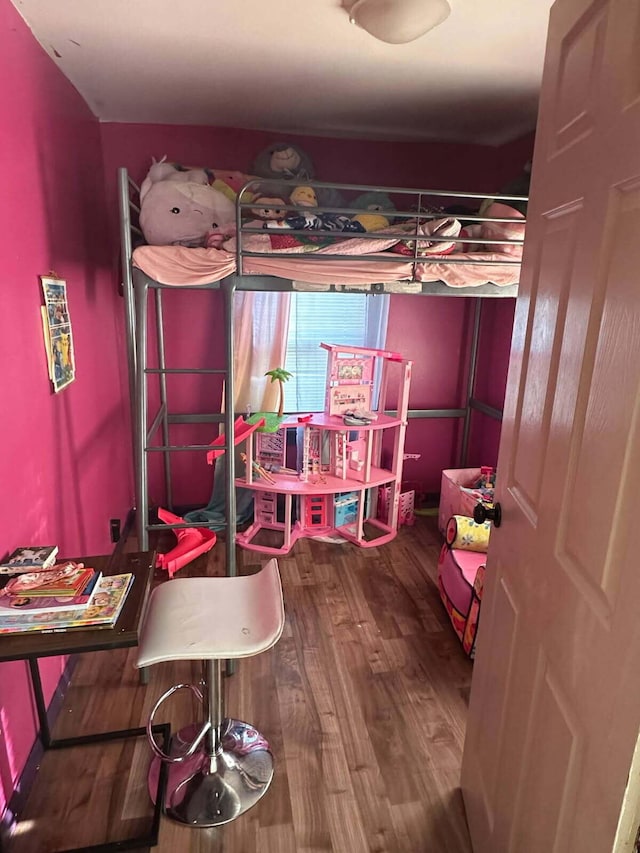 bedroom featuring wood finished floors