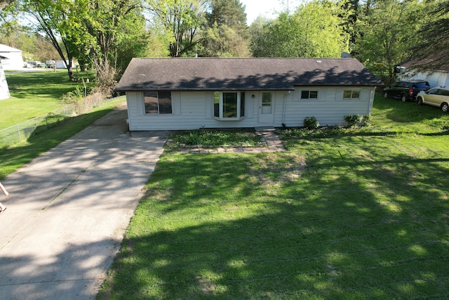 5105 Kelly Rd, Flint, MI 48504 - single story home featuring concrete driveway and a front lawn