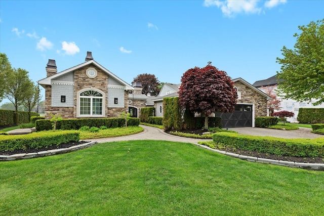 3767 Carrie Ln, Walled Lake, MI 48390 - view of front facade featuring stone siding, a front lawn, a chimney, and a garage