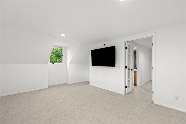 3767 Carrie Ln, Walled Lake, MI 48390 - additional living space with light carpet, baseboards, recessed lighting, and vaulted ceiling