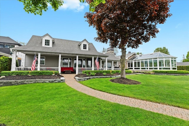 3767 Carrie Ln, Walled Lake, MI 48390 - view of front of property with a front yard and a porch