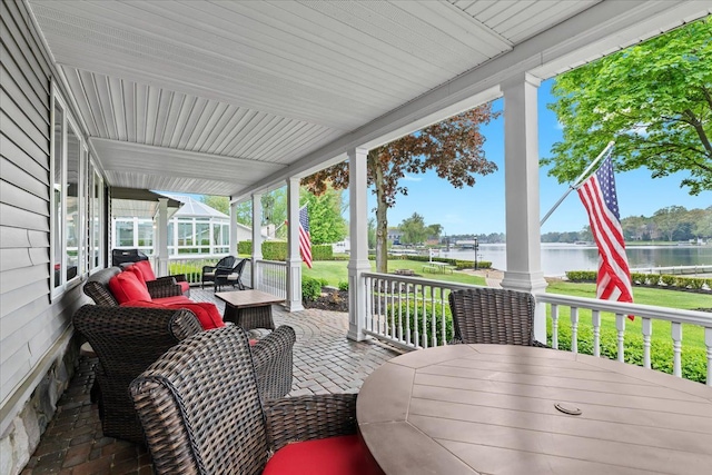 3767 Carrie Ln, Walled Lake, MI 48390 - view of patio featuring a water view and a porch