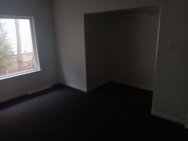 1517 Tacoma St, Flint, MI 48503 - unfurnished room with dark colored carpet and baseboards