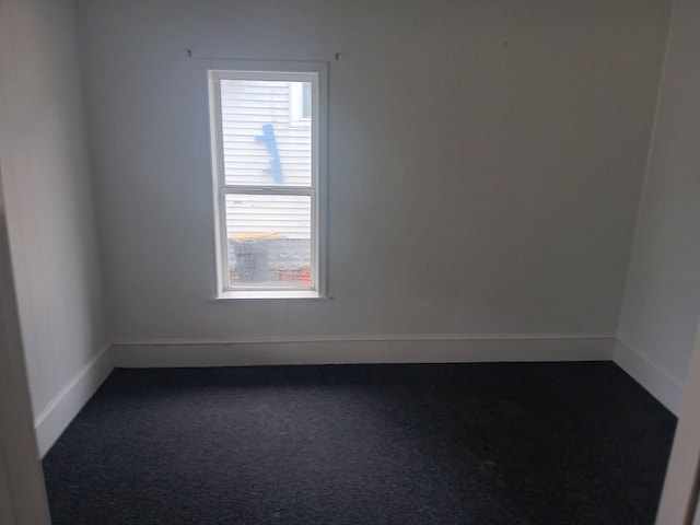 1517 Tacoma St, Flint, MI 48503 - spare room with dark colored carpet and baseboards
