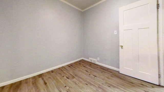 11376 Rivard Ave, Warren, MI 48089 - spare room with light wood-style flooring, ornamental molding, and baseboards