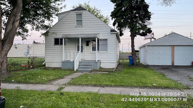 11376 Rivard Ave, Warren, MI 48089 - bungalow featuring an outbuilding and a detached garage