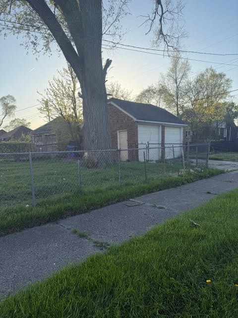 11101 College St, Detroit, MI 48205 - view of side of home featuring a detached garage
