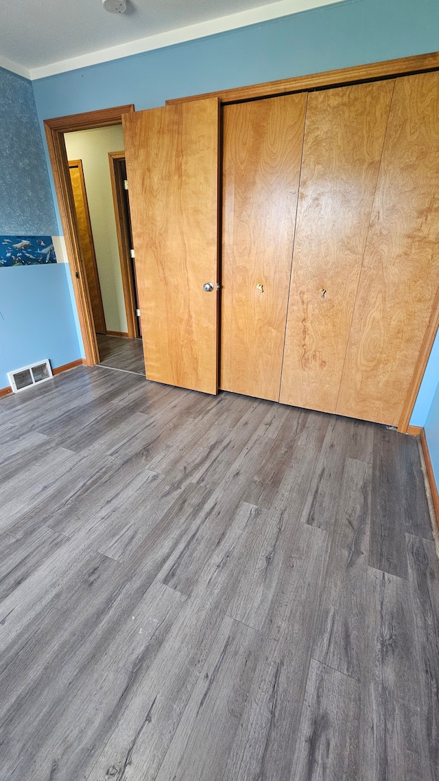 unfurnished bedroom featuring wood finished floors