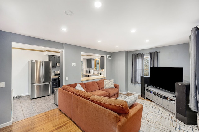 151 Rosetta Ct, Auburn Hills, MI 48326 - living area featuring baseboards, recessed lighting, and light wood finished floors