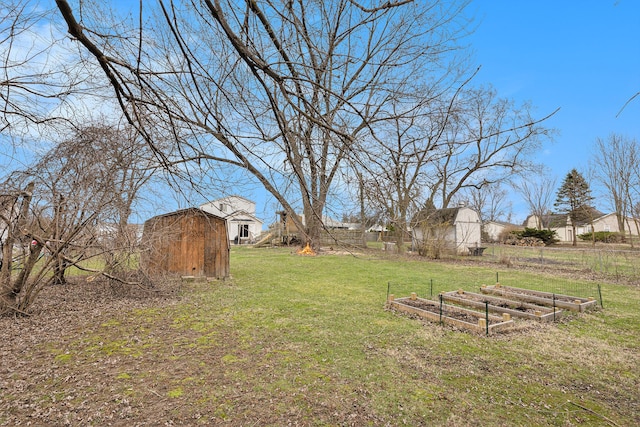 151 Rosetta Ct, Auburn Hills, MI 48326 - view of yard featuring a garden, a storage shed, and an outbuilding