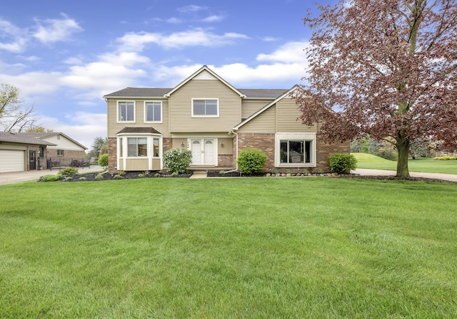 744 Lockmoore Ct, Rochester Hills, MI 48307 - traditional-style house featuring a front lawn, brick siding, concrete driveway, a garage, and french doors