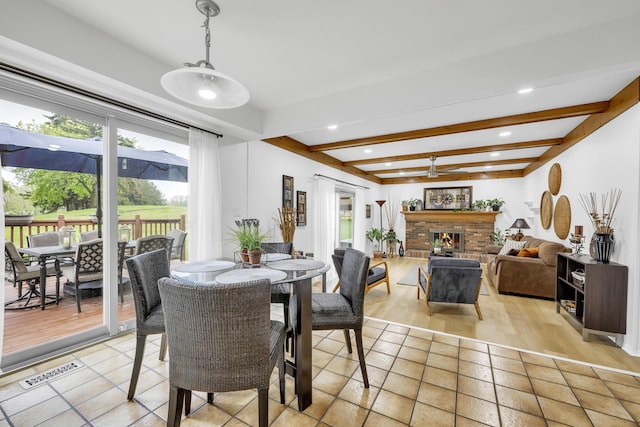 744 Lockmoore Ct, Rochester Hills, MI 48307 - dining room with beam ceiling, a fireplace, and recessed lighting