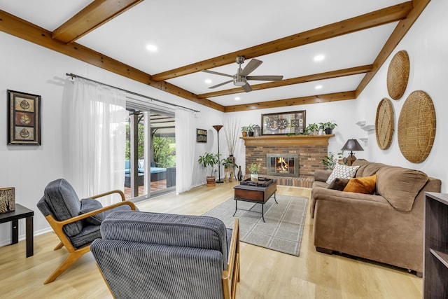 744 Lockmoore Ct, Rochester Hills, MI 48307 - living room featuring beamed ceiling, ceiling fan, light wood finished floors, a fireplace, and baseboards