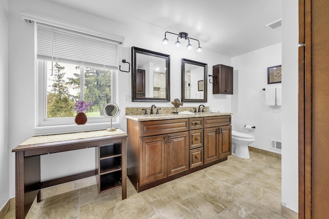744 Lockmoore Ct, Rochester Hills, MI 48307 - bathroom with toilet, double vanity, and baseboards