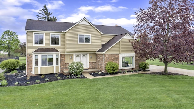 744 Lockmoore Ct, Rochester Hills, MI 48307 - view of front of property with a front lawn, a shingled roof, and brick siding
