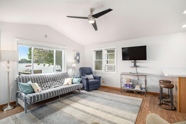 820 N Werners Landing Dr, Bronson, MI 49028 - living room featuring vaulted ceiling, a ceiling fan, wood finished floors, baseboards, and cooling unit