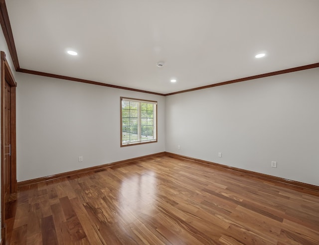 1334 Larayne Dr, Troy, MI 48085 - unfurnished room featuring crown molding, wood finished floors, baseboards, and recessed lighting