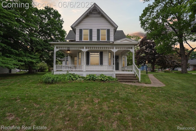101 Hill St, Stockbridge, MI 49285 - victorian home featuring a porch and a lawn