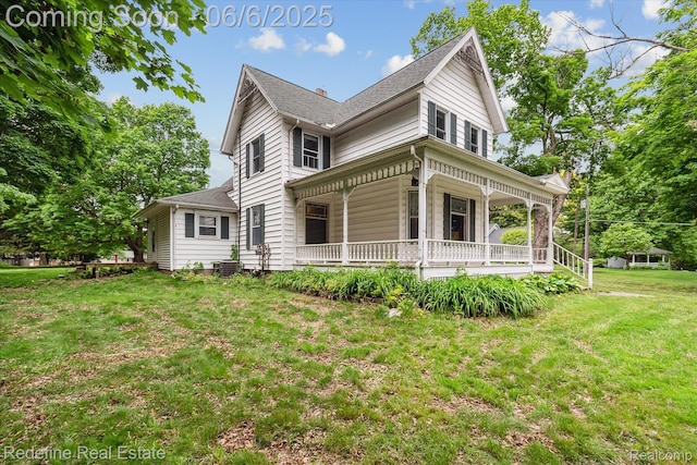 101 Hill St, Stockbridge, MI 49285 - view of side of property with covered porch, a lawn, roof with shingles, and central AC unit