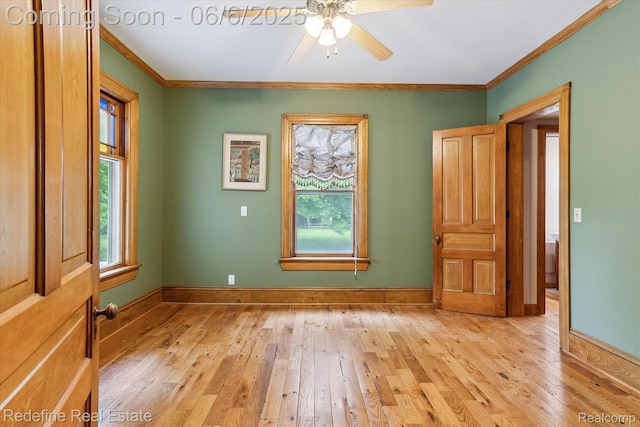101 Hill St, Stockbridge, MI 49285 - unfurnished room featuring light wood-style floors, a ceiling fan, crown molding, and baseboards