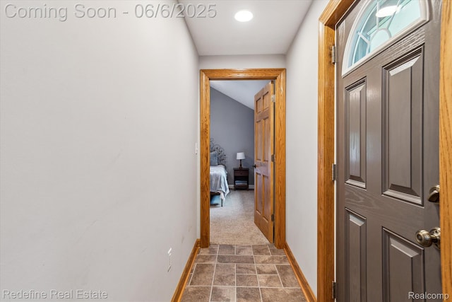 101 Hill St, Stockbridge, MI 49285 - corridor with baseboards and dark stone finish floors